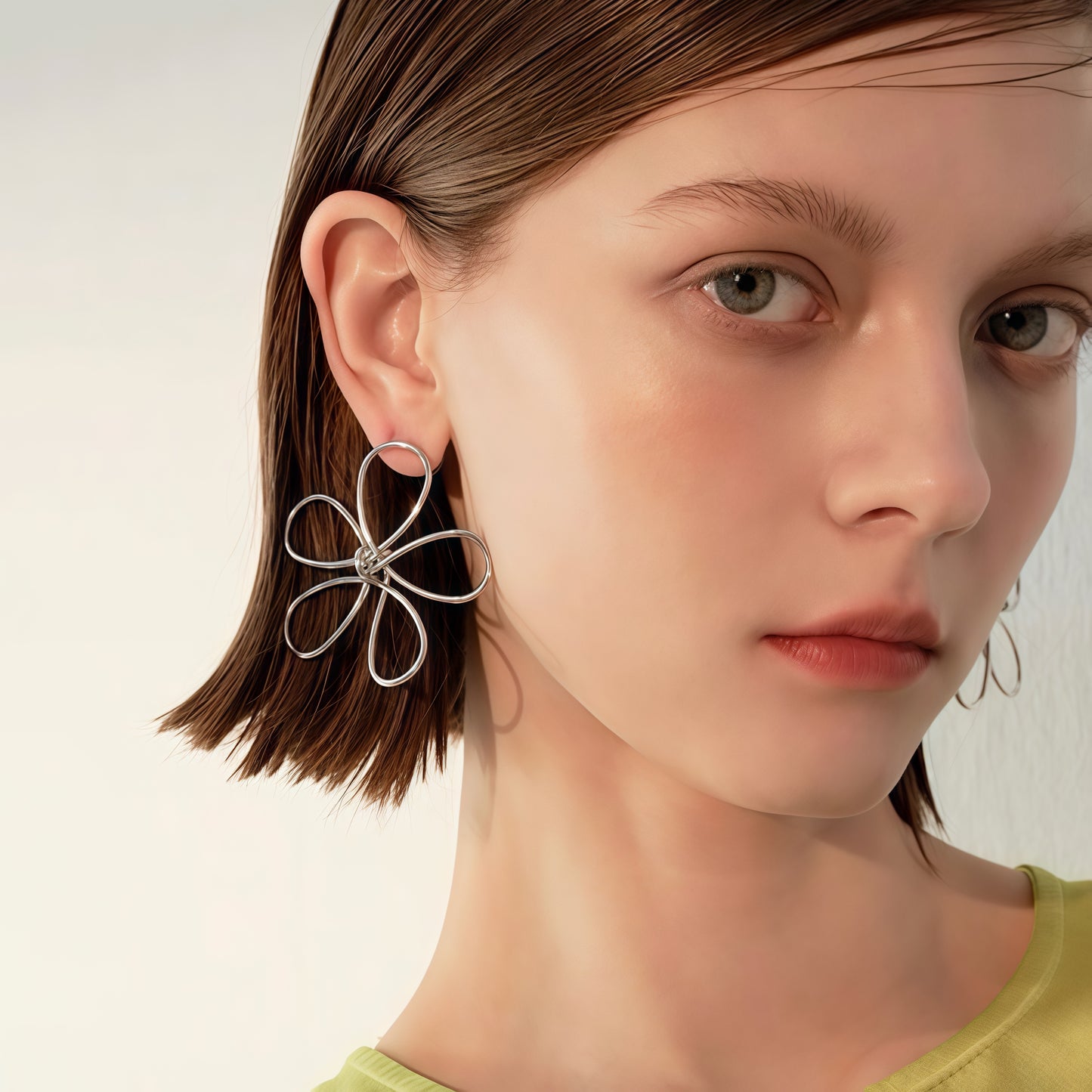 Handformade örhängen med blommig tråd