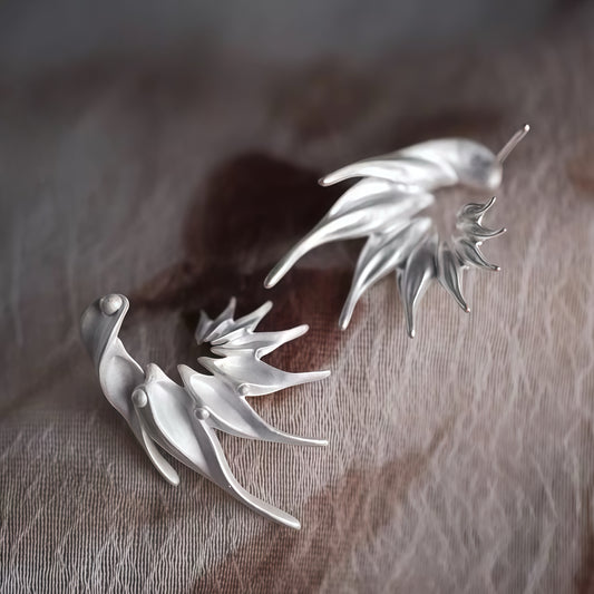Wings of Light Earrings – Sculptural Silver Flow