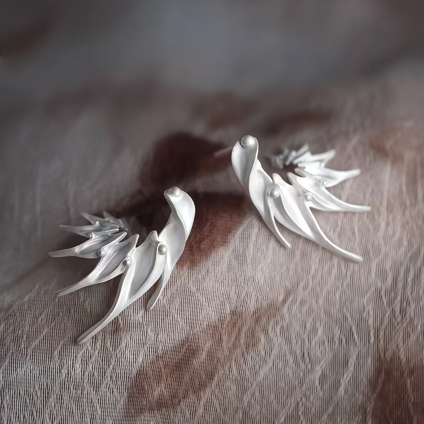 Wings of Light Earrings – Sculptural Silver Flow