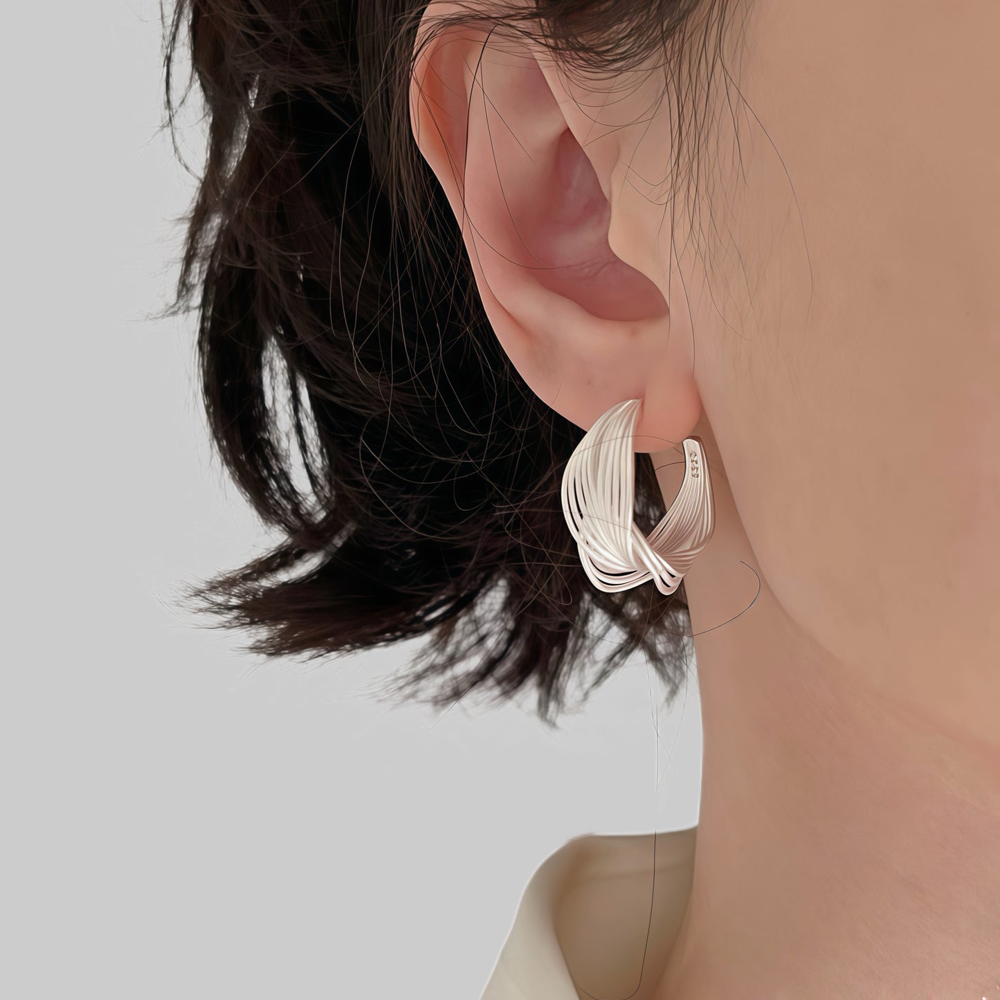 Interwoven Silver Hoop Earrings – Sculptural Modern Design
