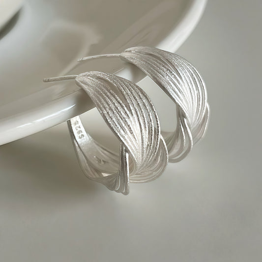 Interwoven Silver Hoop Earrings – Sculptural Modern Design