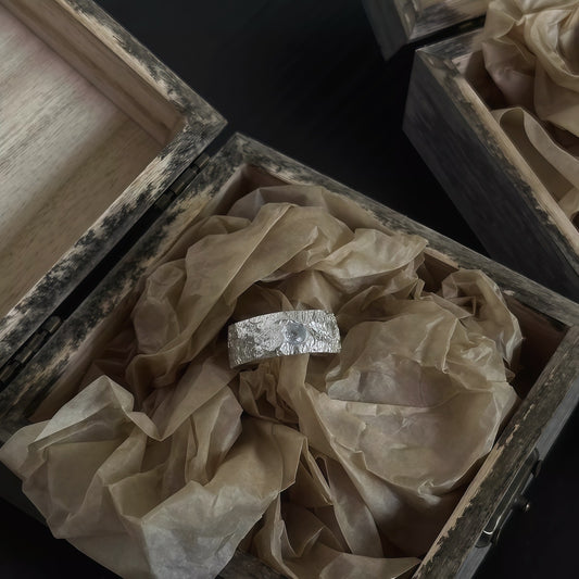 Aurora Crest Ring — Textured Silver with Ice-Blue Gem