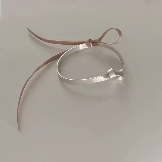Knoted Ribbon Bangle – Adjustable Silver Bracelet